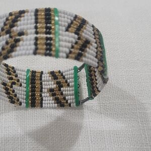 Elegant Beaded Bracelet with Gold, Black, and White Accents